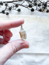 Load image into Gallery viewer, Silver wrapped Golden Healer Quartz point
